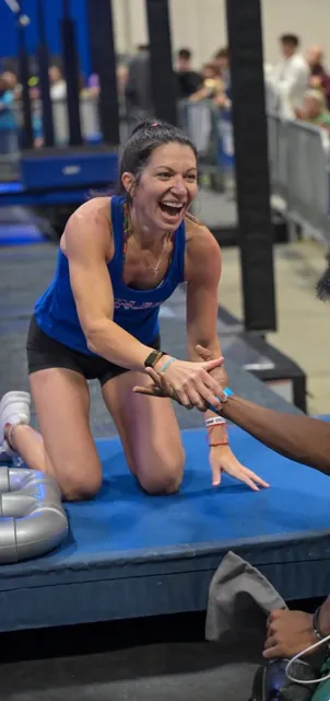 Ashley Kiser laughing as she shakes hands after her run