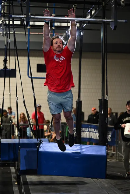 David Kiser leaping from a swinging step up to a bar