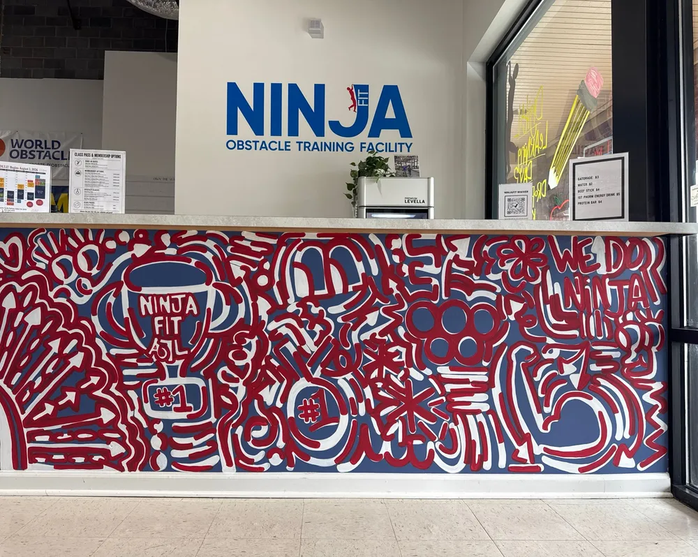 The hand-painted mural on NinjaFit's front desk