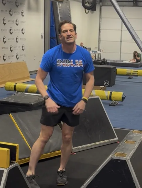 Nicholas Parker in a blue Team Ninja shirt on the course at Motive