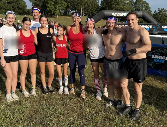 The NinjaFit team in red, white and blue Ninja shirts and flag headbands together at the Savage Race start